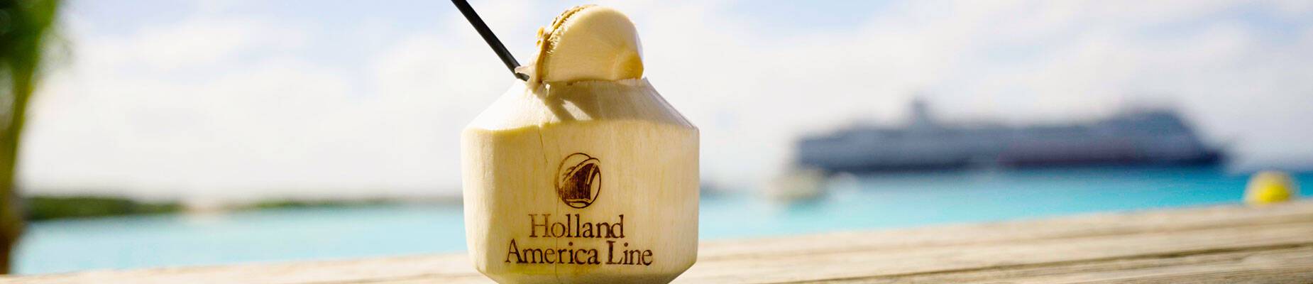 A coconut drink on a wooden ledge