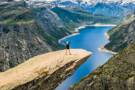 Girl standing on Trolltunga in Stavanger
