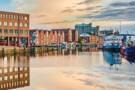 Kiel's cityscape reflected in water