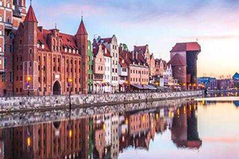 The cityscape of Gdansk reflected in the water