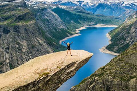 Girl standing on Trolltunga in Stavanger