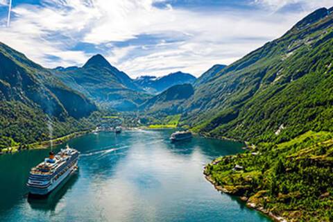 Cruise ships sailing in and out of Geirangerfjord