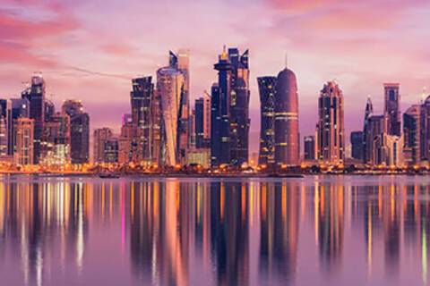 Doha's cityscape reflected in the water